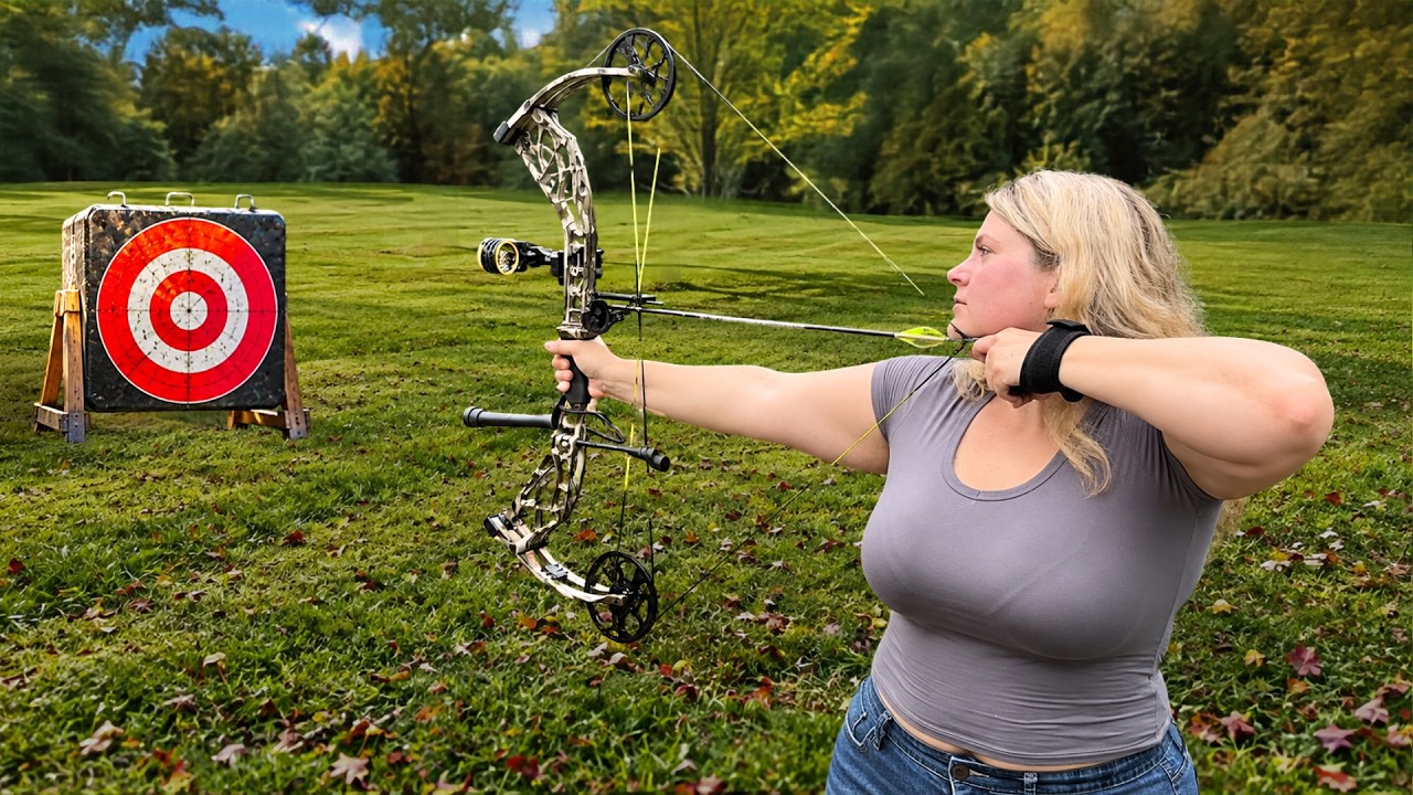Bree drawing a compound bow at a target